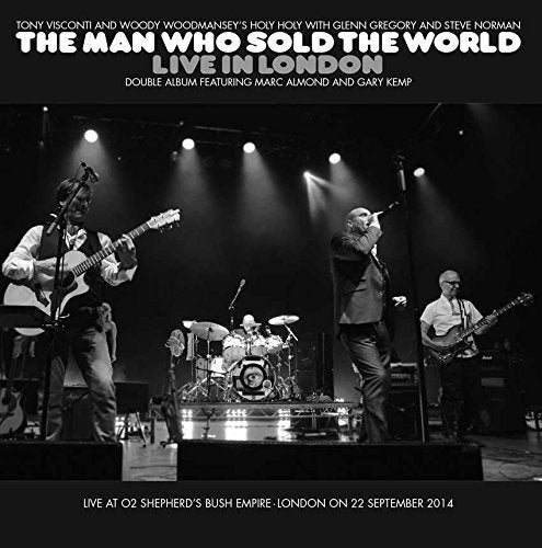 Black and white album cover featuring a live band performing on stage.