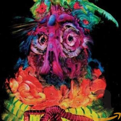 CD cover art: psychedelic, colorful face with floral and flame details.