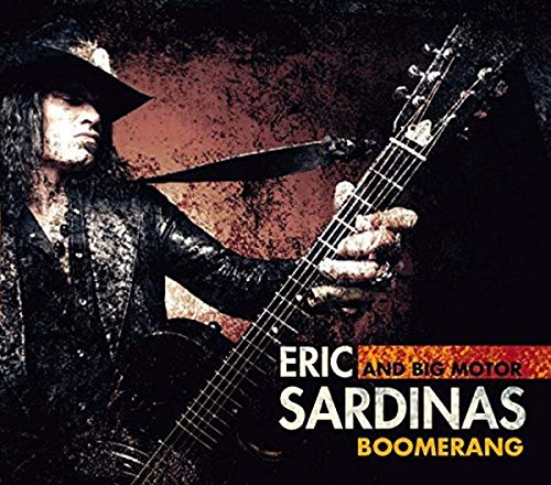 Musician playing guitar, album cover for Eric Sardinas’ “Boomerang” CD.