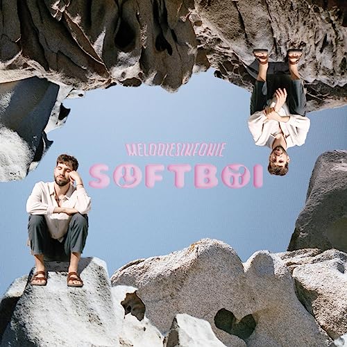 Album cover: man in white shirt, mirrored and surrounded by rocks.