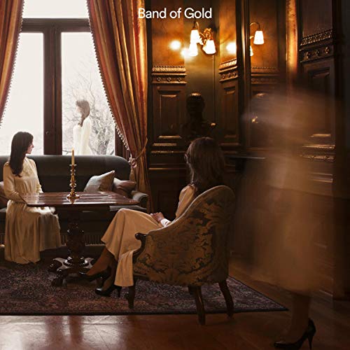 Women in a dimly lit, ornate room, album cover for Band of Gold.