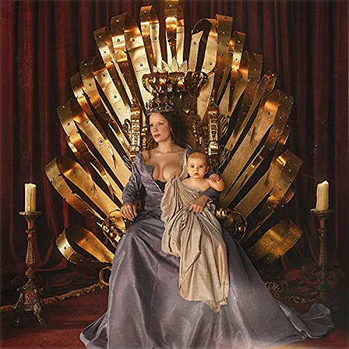 Woman in a purple dress sitting on a gold throne with a baby.