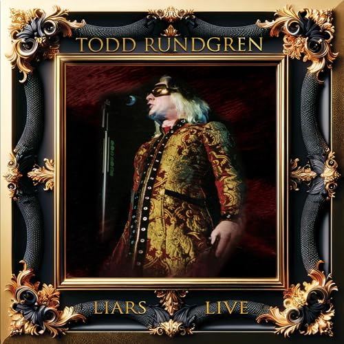 Todd Rundgren album cover, ornate gold frame, artist in patterned suit.