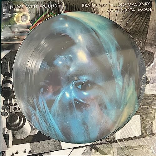 Vinyl record with a distorted, blue-toned face image on the label.