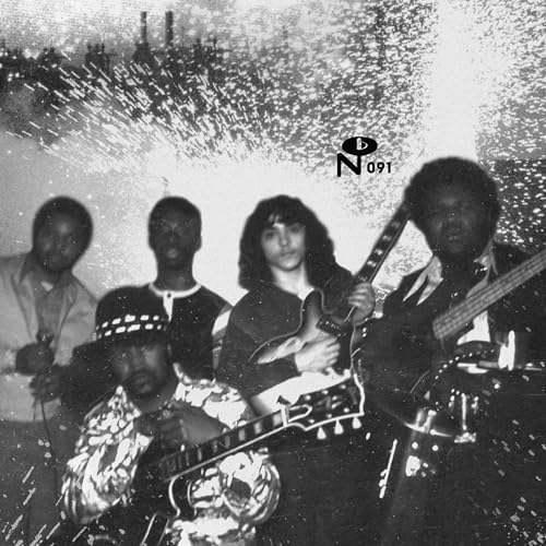 Black and white photo of a 1970s band with guitars and drums.