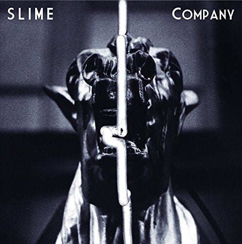 Dark album cover featuring a distorted animal sculpture with a light.
