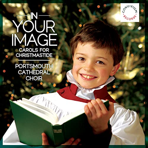 CD cover featuring a choirboy with an open hymn book and Christmas tree.