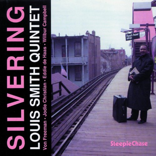CD cover: man with briefcase on a train platform.