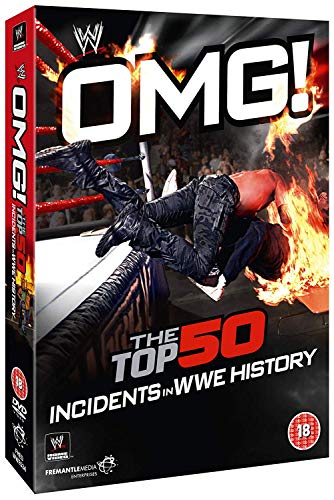 DVD cover showing a wrestler falling through a flaming table in a ring.