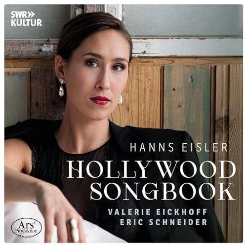 CD cover featuring a woman in black against a rustic wooden background.