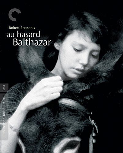 Black and white film poster featuring a boy embracing a donkey.