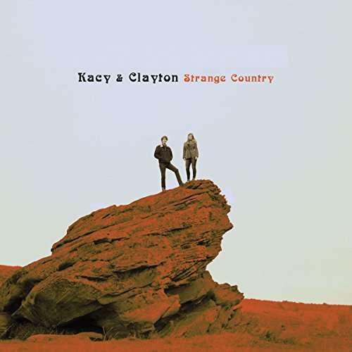Kacy & Clayton album cover: couple standing on a red rock formation.