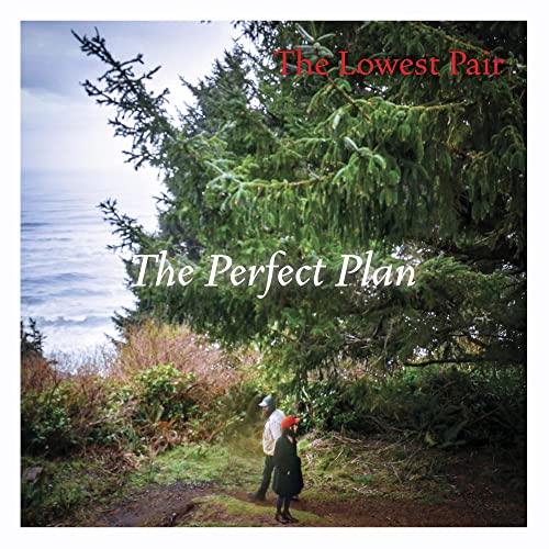 CD cover with two figures overlooking the ocean and trees.