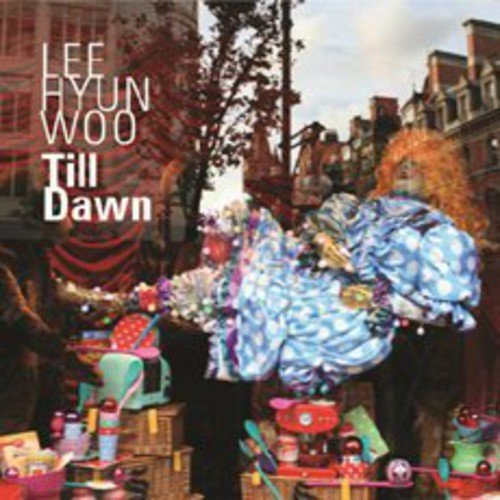 CD cover for "Till Dawn" by Lee Hyun Woo, featuring colorful imagery.