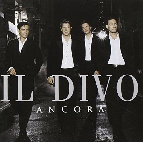 Four men in suits walking down a dark street, with Il Divo Ancora text overlaid.