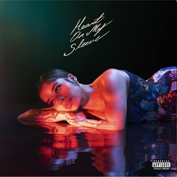Vinyl album cover featuring a woman in water with red lighting.