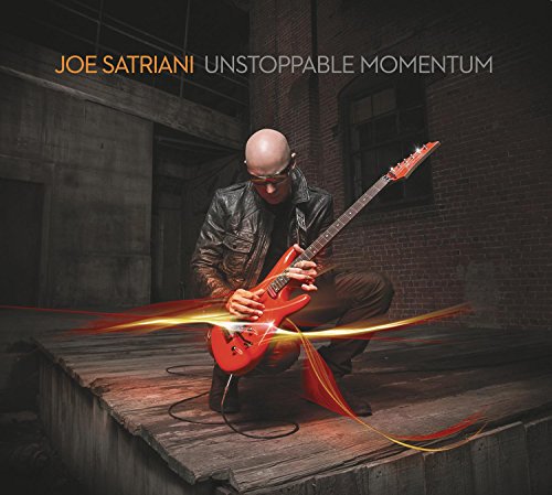 Joe Satriani playing a red electric guitar, album cover art.