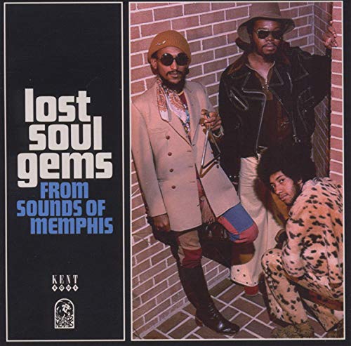 CD cover: three men in 1970s style, brick wall background.