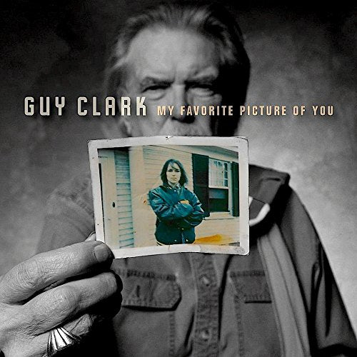 Guy Clark album cover featuring a man holding a small photograph.