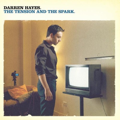 CD cover featuring Darren Hayes standing beside an old television.