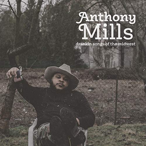 Album cover featuring Anthony Mills with a guitar, trees in background.