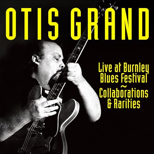 Otis Grand album cover featuring a guitarist playing a black electric guitar.