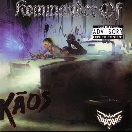 CD cover: Plasmatics' Wendy O Williams atop a car in smoky purple light.