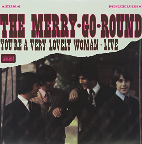 Album cover for The Merry-Go-Round featuring four men in suits.