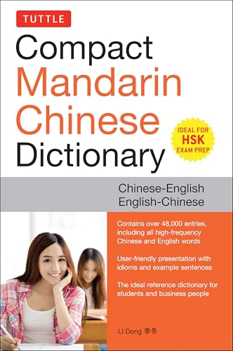 Compact Mandarin Chinese dictionary cover with student studying, bilingual text.