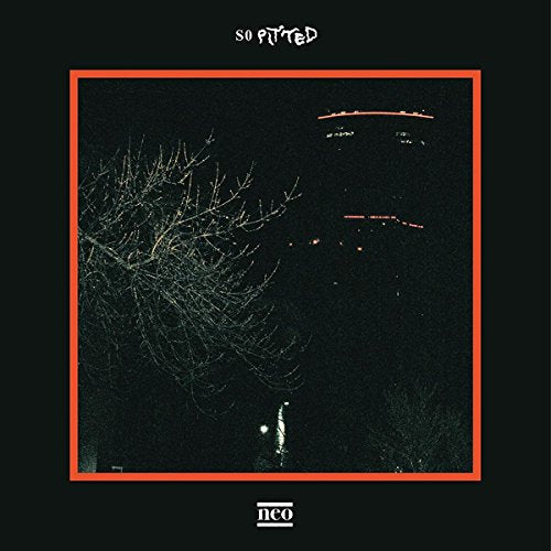 Cassette cover with a dark, grainy image of bare branches and red lights.