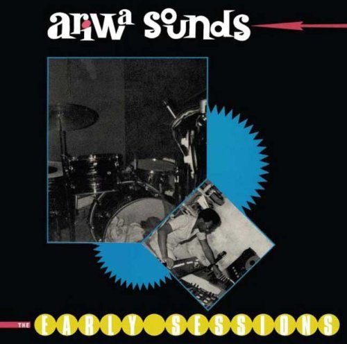 CD cover: black background with a drum kit and musician photo inside blue burst.