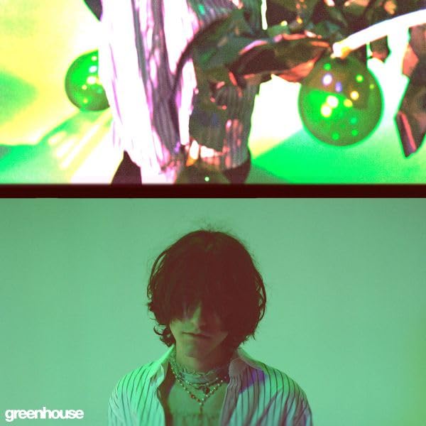 Green and purple album cover featuring a person with long hair.