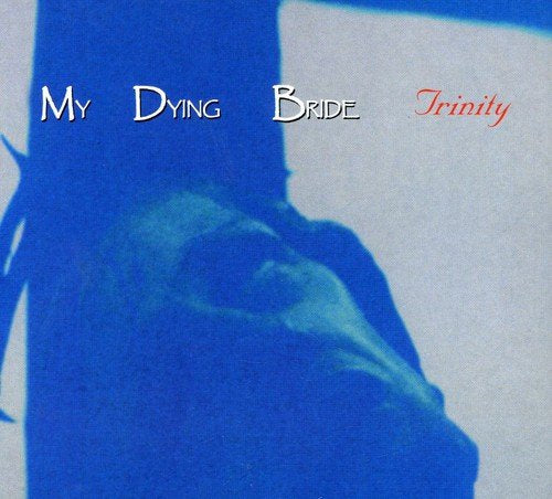 Album cover features a blue-tinted silhouette of a figure on a cross.