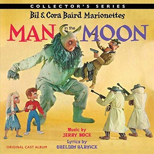 CD cover for “Man In The Moon” featuring marionette characters.