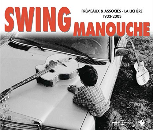 CD cover: boy looking at guitar on a vintage car hood.