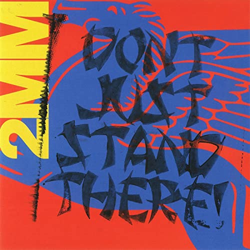 Vinyl record cover with bold text "DON'T JUST STAND THERE!" in black and yellow.