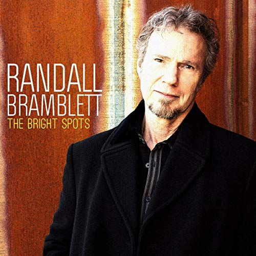 Album cover featuring Randall Bramblett’s portrait against an orange textured background.