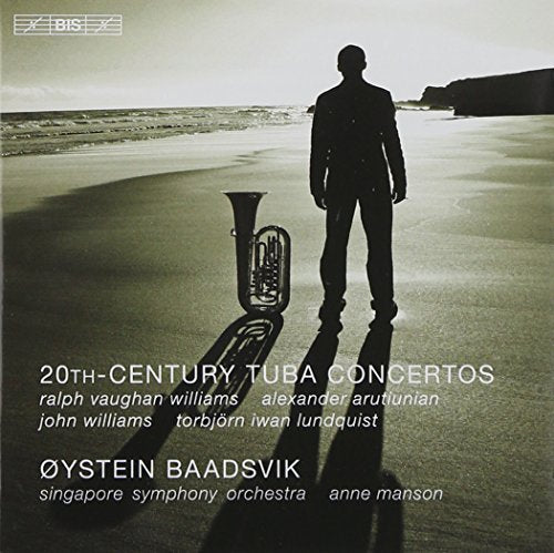 CD cover: Tuba player standing on a beach, with instrument nearby.