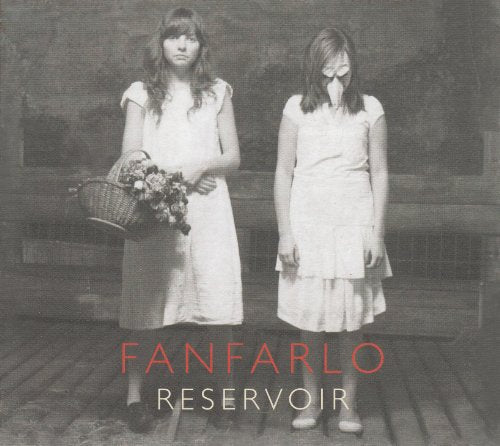 Black and white photo of two girls in white dresses, album cover.