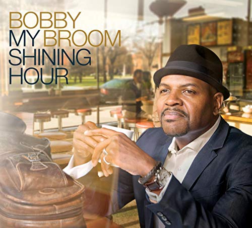 Bobby Broom album cover, portrait of a man with a hat, cafe background.