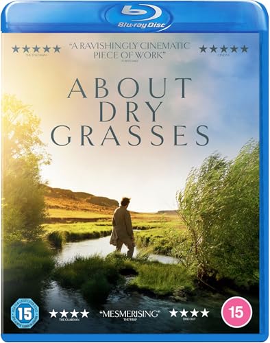 Blu-ray cover for About Dry Grasses featuring a man standing by a stream.