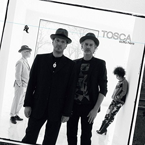 Black and white album cover featuring four people in hats and suits.