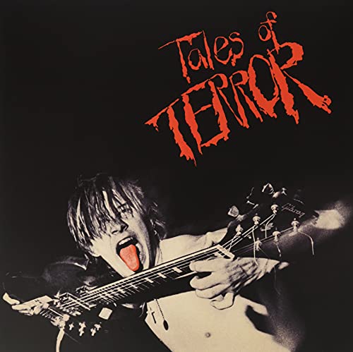 Record album cover: a screaming guitarist with a red title.