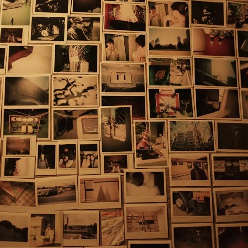 Vinyl album cover with a collage of faded, square black and white photos.