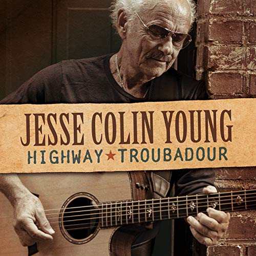 Jesse Colin Young holding a guitar, album cover for "Highway Troubadour".