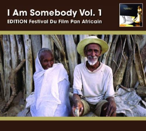 CD cover featuring two elderly people in front of wooden posts.
