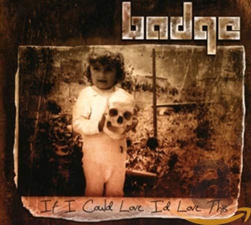 CD cover: child in white suit holding a human skull.