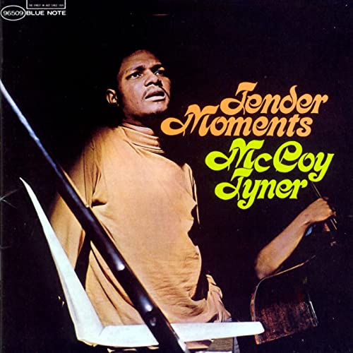 McCoy Tyner album cover, portrait of a man at a piano, orange text.