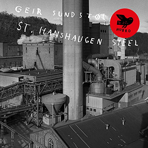 Black and white album cover featuring an industrial steel factory.