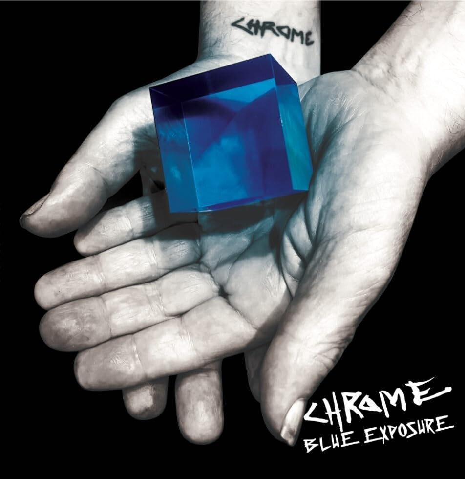 Hand holding a glowing blue cube with "Chrome" text on arm and below.